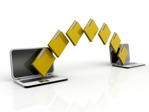 Two laptop computers with file, folde